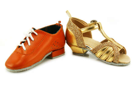 Pair of tiny dancing shoes (men's and woman's) isolated on a white backgroundの写真素材