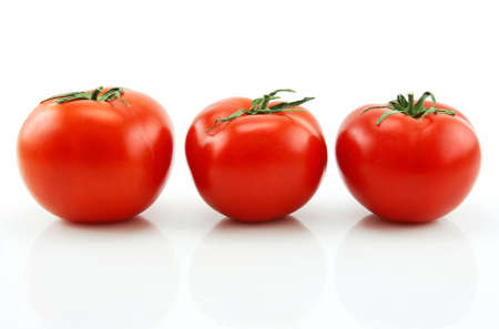 Three Ripe Tomatoes Isolated on White Backgroundの写真素材
