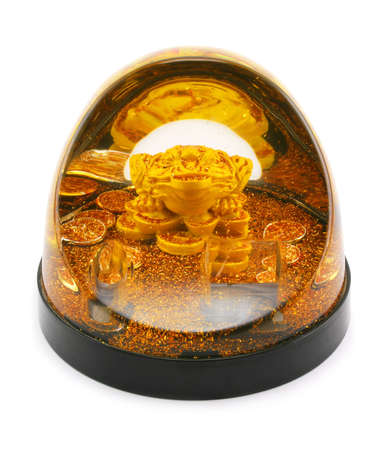 Gold frog and coins isolated on a white backgroundの写真素材