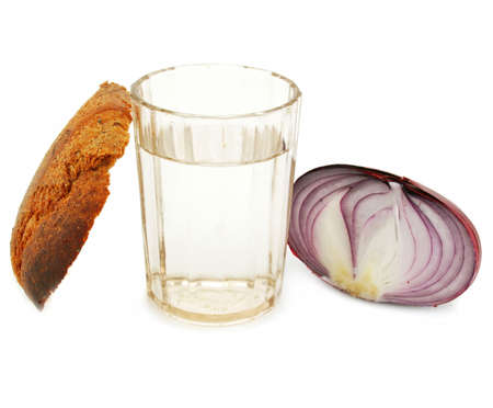 Crust of bread, glass of alcohol and onion isolatedの写真素材