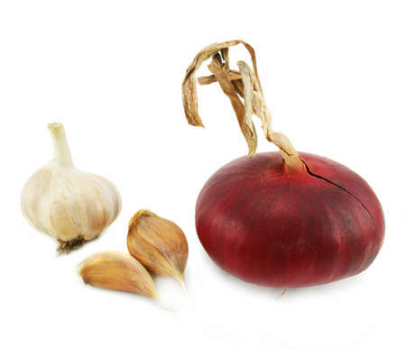 Few cloves of garlic and red onion isolated on a white backgroundの写真素材