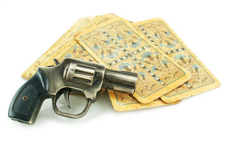 Gun and pack of cards isolated on a white backgroundのeditorial素材