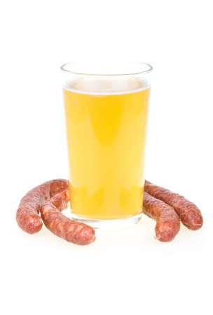 Cup of beer and grilled sausages isolated in white backgroundの写真素材