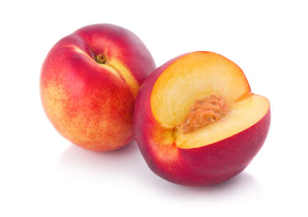 Fresh peach fruits with cut isolated on white background の写真素材