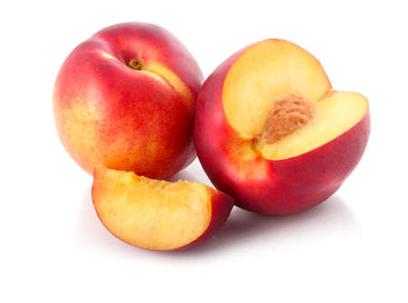Fresh peach fruits with cut isolated on white background の写真素材