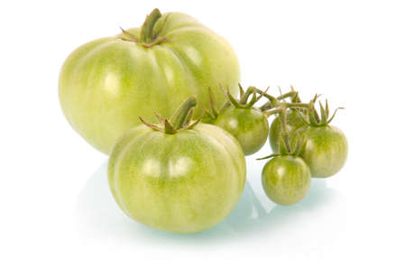 Green tomatoes vegetables isolated on white background の写真素材