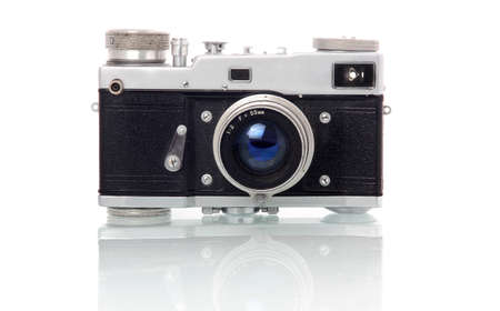 Retro-styled 35 mm film camera isolated on white backgroundの写真素材