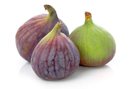 Ripe purple and green fig fruit isolated on white backgroundの写真素材