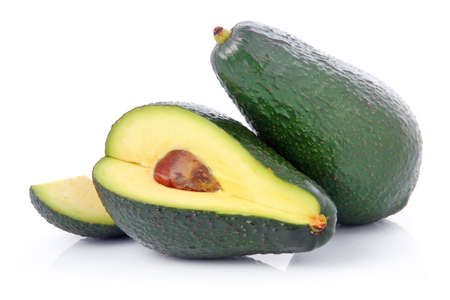 Ripe sliced avocado fruits isolated on white background の写真素材