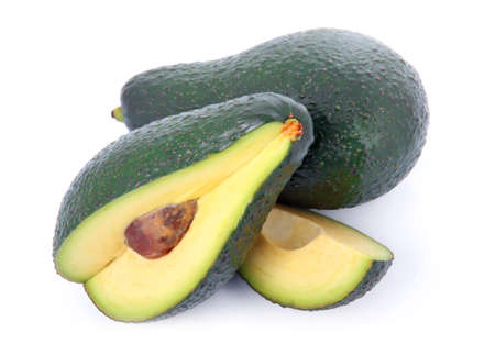 Ripe sliced avocado fruits isolated on white background の写真素材