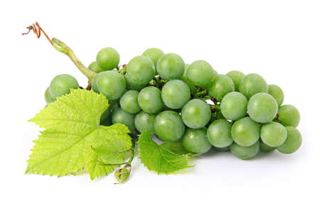 Fresh grape fruits with green leaves isolated on white background の写真素材