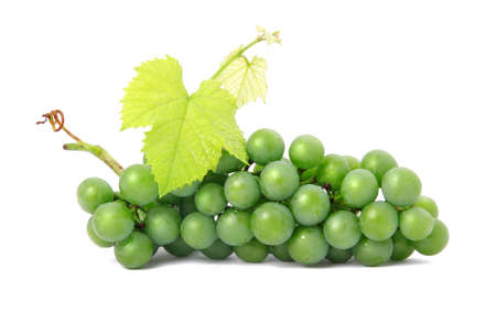 Fresh grape fruits with green leaves isolated on white background の写真素材