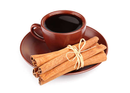Cup of coffee and bunch of cinnamon isolated on white backgroundの写真素材
