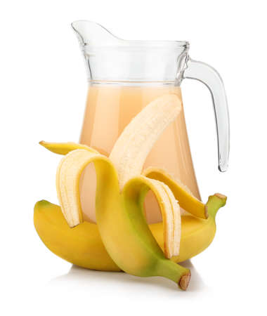 Full jug of banana juice and fruits isolated on white backgroundの写真素材