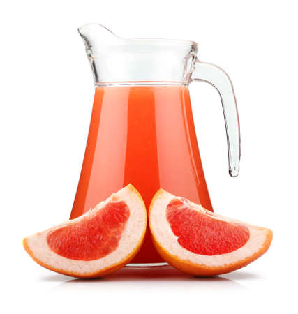 Full jug of grapefruit juice and fruits isolated on white backgroundの写真素材