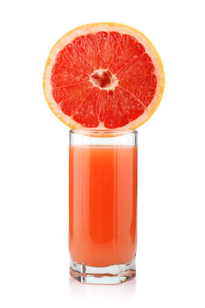 Glass of grapefruit juice with slices isolated on white backgroundの写真素材