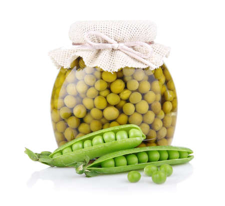 Jar of green pea with fresh pods isolated on white backgroundの写真素材