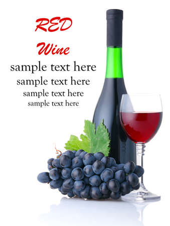 Bottle and goblet of red wine with branch of grapes isolated on white backgroundの写真素材