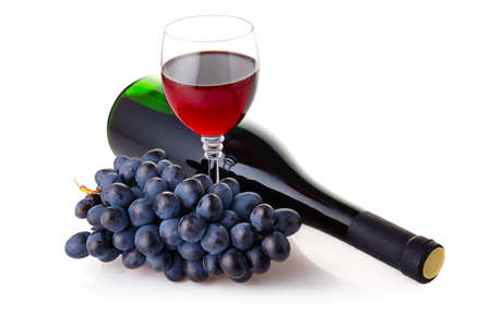 Bottle and goblet of red wine with branch of grapes isolated on white backgroundの写真素材