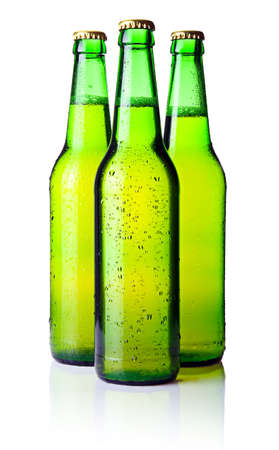 Three green bottles of beer isolated on white backgroundの写真素材