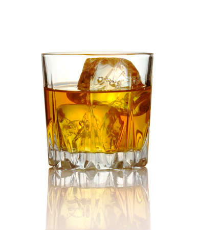 Glass of whiskey and ice isolated on white backgroundの写真素材