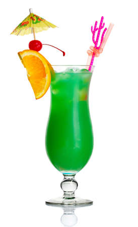 Green alcohol cocktail with orange slice and umbrella isolated on white backgroundの写真素材