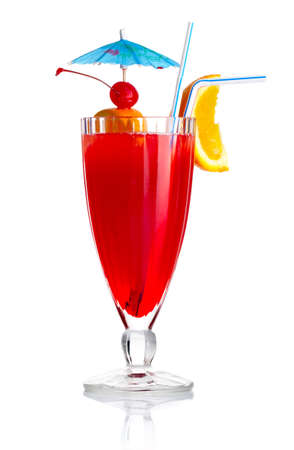 Red alcohol cocktail with orange slice and umbrella isolated on white backgroundの写真素材