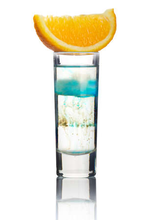 Short alcohol cocktail with orange slice isolated on white backgroundの写真素材