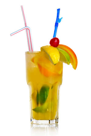 Yellow alcohol cocktail with fruit slices isolated on white backgroundの写真素材