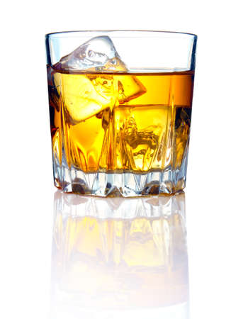 Whiskey glass with ice cubes and reflectionsの写真素材