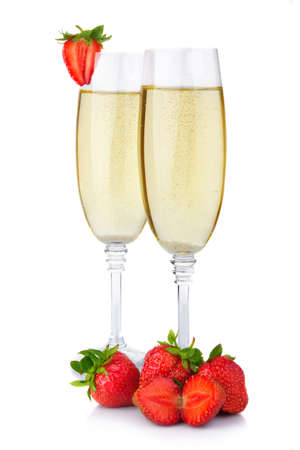 Two glasses of champagne and fresh strawberry isolated on white background の写真素材