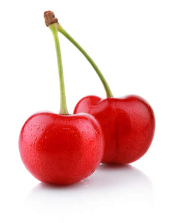 Ripe wet cherry berries isolated on white background の写真素材