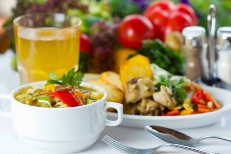 Business lunch with soup, salad and juice (closeup, slective focus)の写真素材