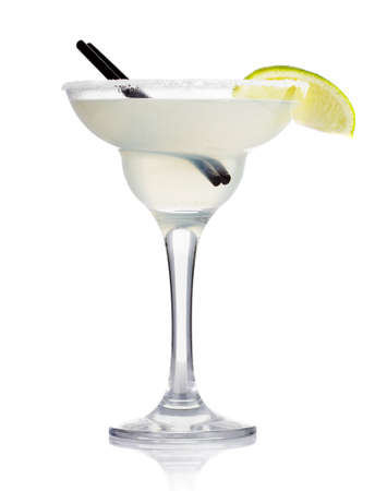 Transparent alcohol cocktail with lime slice isolated on whiteの写真素材