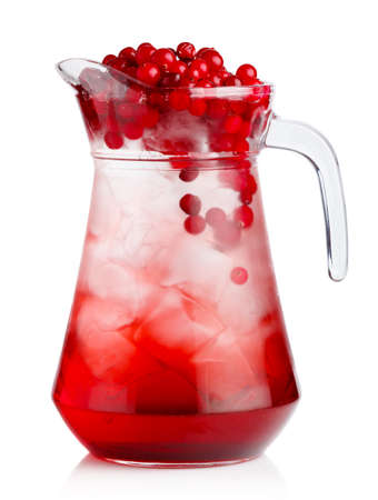 Full jug of fresh cranberries nonalcoholic cocktail with berries isolatedの写真素材
