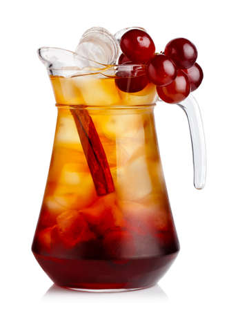 Full jug of fresh nonalcoholic cocktail with grapes and cinnamon stick isolated  の写真素材