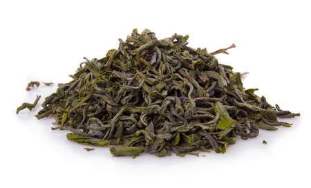 Heap of dry green tea isolated on white background の写真素材