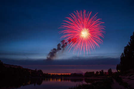 Fireworks Over Lake at Nightの写真素材