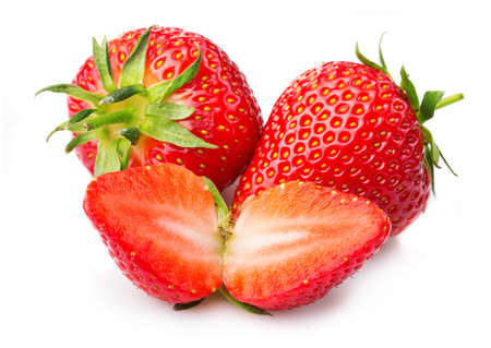 Strawberries with leaves and slices isolated on a white backgroundの写真素材