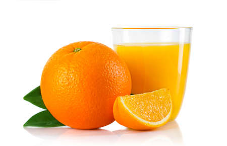 Glass with orange juice and fruits with green leaves isolated on white backgroundの写真素材
