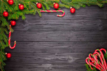 Christmas fir tree on black wooden grunge backgroundの写真素材