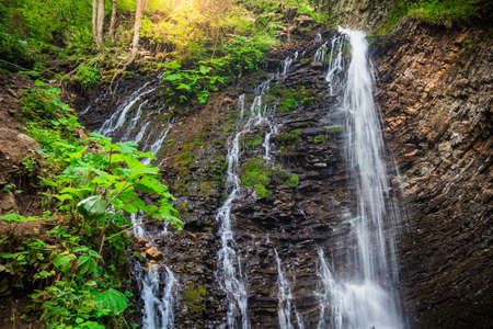 Mountainwaterfall Guk in the wood landscape. Ukrainian Carpathians.の写真素材