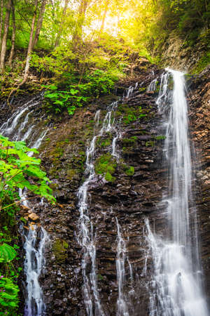 Mountain waterfall Guk in the wood landscape. Ukrainian Carpathians.の写真素材