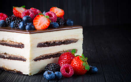 Christmas fir tree on black wooden grunge backgroundの写真素材