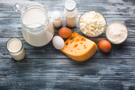 Dairy products grocery assortment on rustic wooden table. Top view.の写真素材