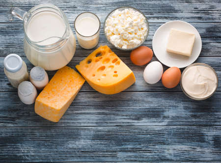 Dairy products grocery assortment on rustic wooden table. Top view.の写真素材