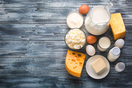 Dairy products grocery assortment on rustic wooden table. Top view.の写真素材