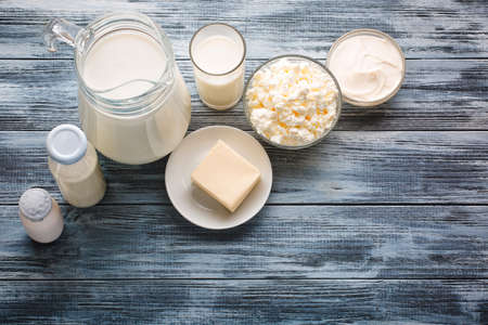 Dairy products grocery assortment on rustic wooden table. Top view.の写真素材