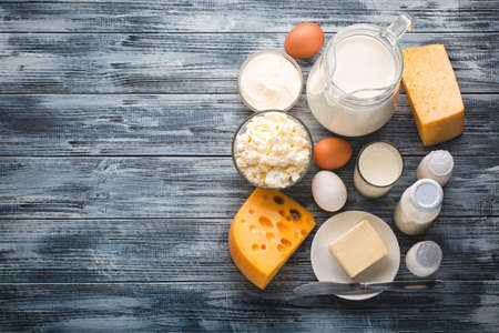 Dairy products grocery assortment on rustic wooden table. Top view.の写真素材