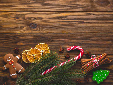 Christmas homemade gingerbread cookies on the wooden backgroundの写真素材